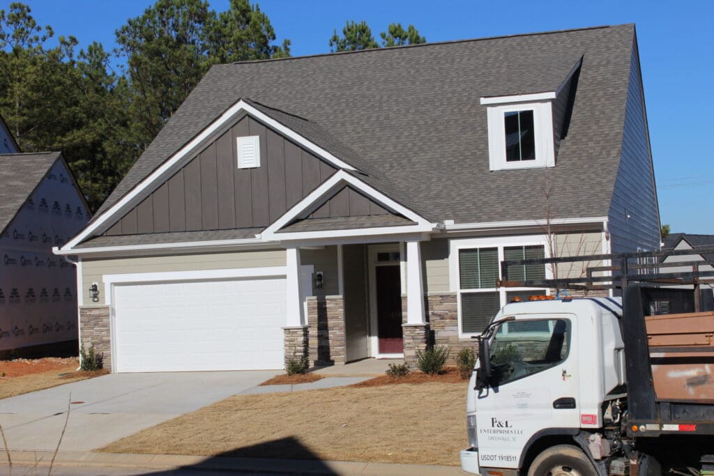 Frontview of a home with a P&L truck in front of it