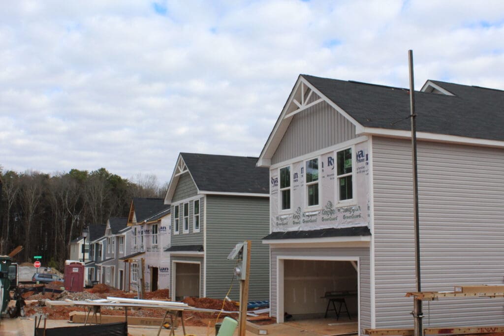 Siding being installed in a residential development